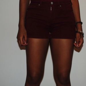 Two pairs of black and red shorts